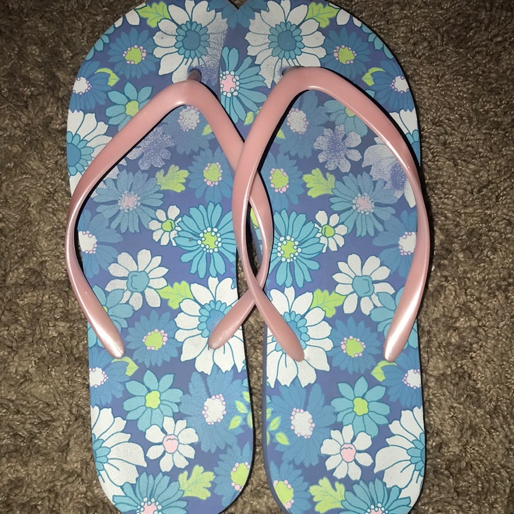 Woman’s floral flip flops